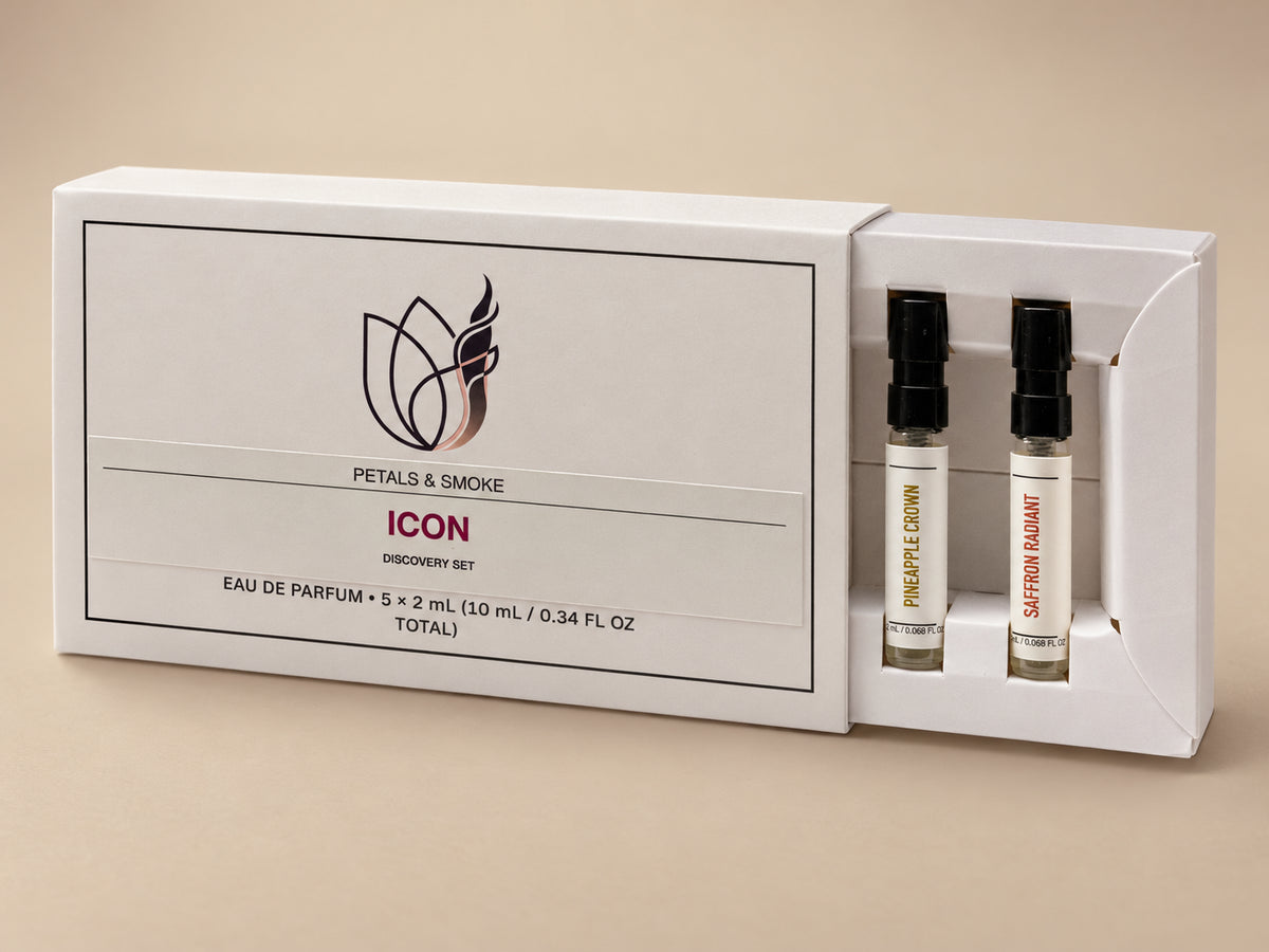 AI-enhanced Icon Discovery Box with its tray partly slid from the printed sleeve, revealing Pineapple Crown and Saffron Radiant vials. The complete box contains five 2 mL spray samples, 10 mL total.