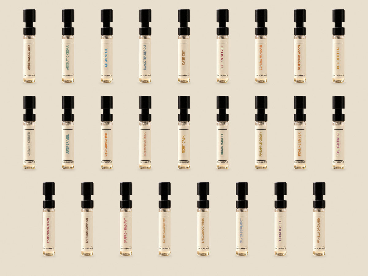 Digital visualization of all 26 individually labeled 2 mL spray vials in the Try It All set. Label title colors matched to Wizard submissions. No box or scent cards included.