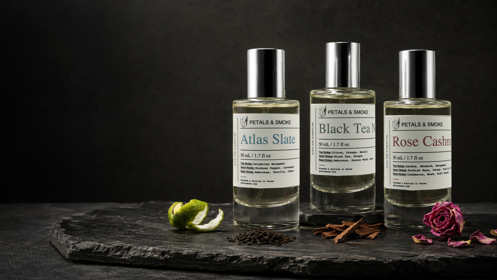 Atlas Slate, Black Tea Neroli and Rose Cashmere with bergamot, tea and rose on dark stone